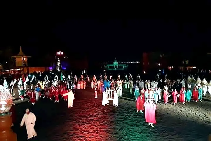 Colourful Fantasia performers in formation at the Chez Ali show