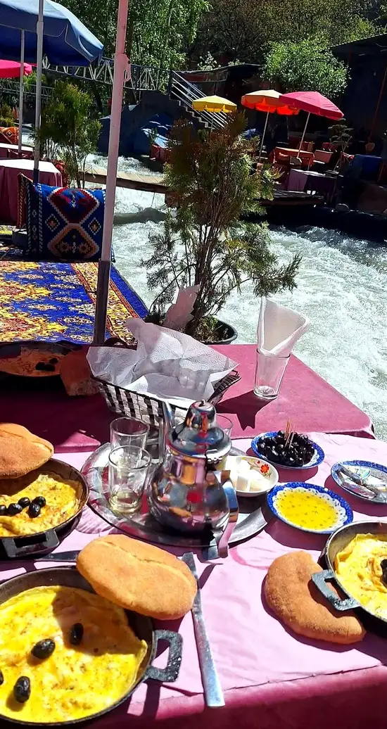 Riverside restaurant tables beside the Ourika river