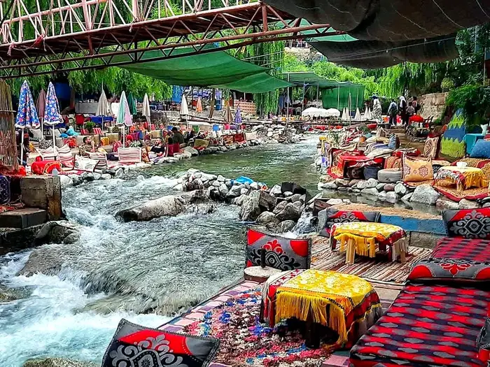 Traditional cushion seating along the Ourika riverside restaurants